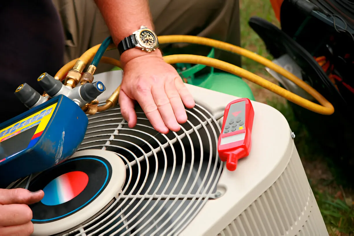 Home 8 Experienced air conditioning contractor in Palmetto inspecting AC system