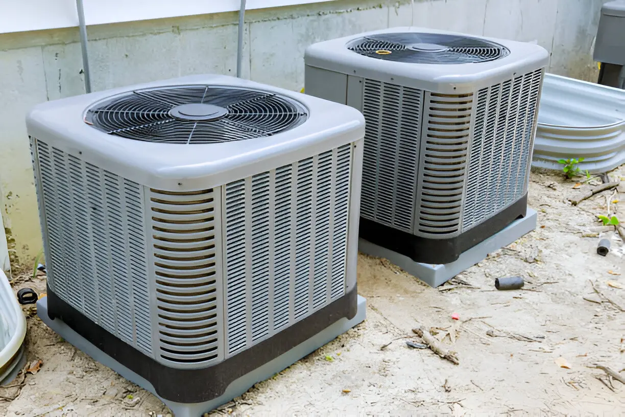 Home 14 HVAC service technician inspecting and maintaining HVAC system indoors
